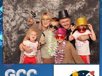 family posing for photobooth