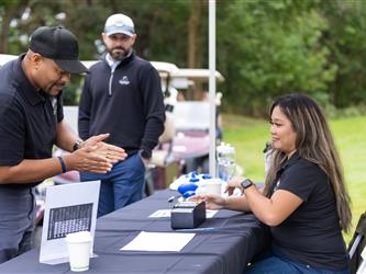 attendees at golf tournament