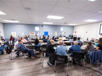 gcc con attendees listening to speaker