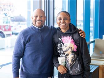 guests posing at entrance