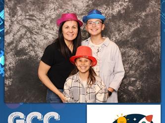 family posing for photobooth