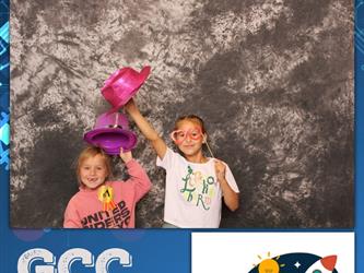 two girls posing for photo booth 