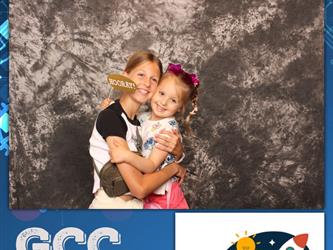 two girls hugging one another 