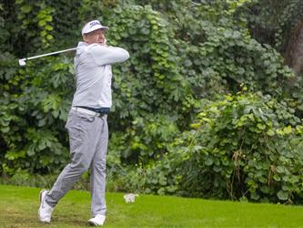 attendees playing golf