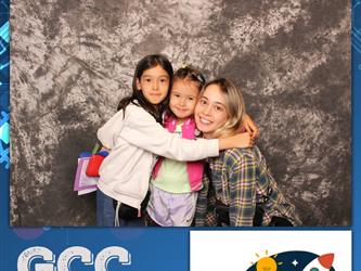 family posing for photobooth