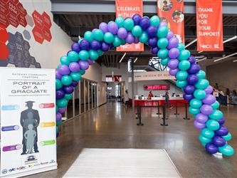 balloon arch with GCC portrait of a graduate