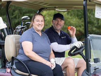 golf attendees in cart