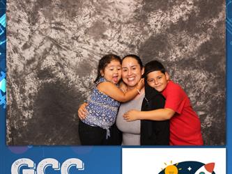 family posing for photobooth