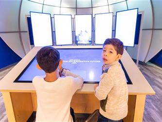 guests playing with interactive exhibit 