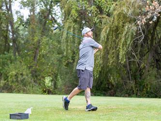 golf player swinging club