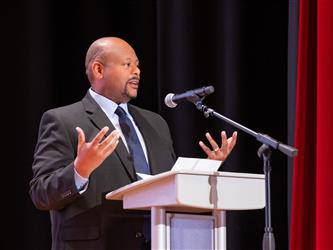 speaker on stage at podium