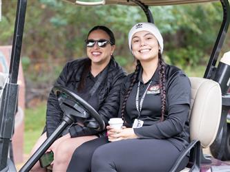 gcc staff in golf cart