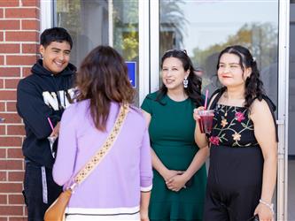 guests posing at doors