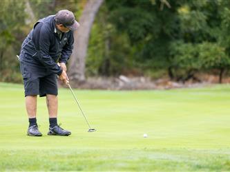 attendee at golf tournament