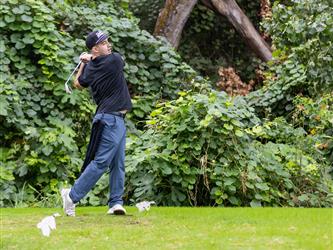 golf player swinging club