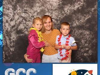 family posing for photobooth